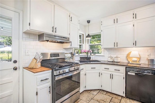 kitchen with black dishwasher, stainless steel gas range oven, under cabinet range hood, white cabinets, and a sink