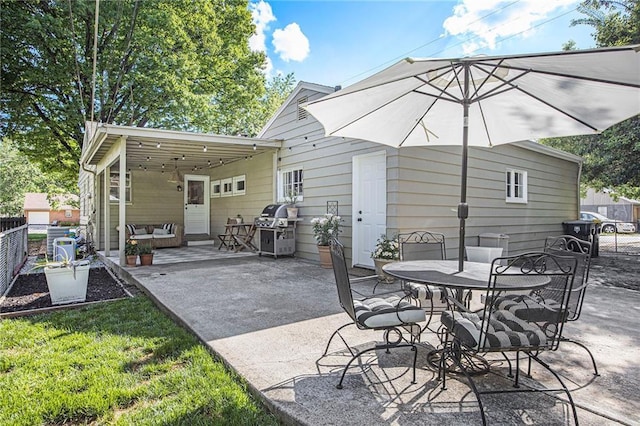 view of patio / terrace featuring fence, area for grilling, and outdoor dining area