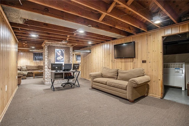 living room featuring carpet floors and wood walls