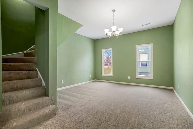 interior space with carpet and a chandelier