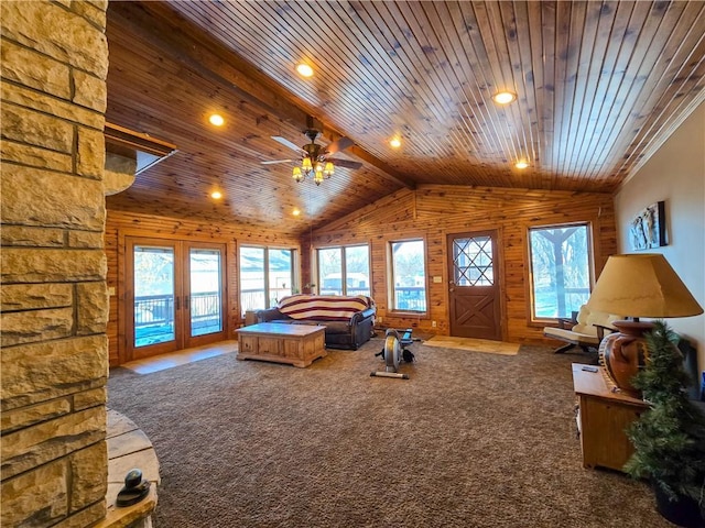 carpeted bedroom featuring lofted ceiling, access to exterior, multiple windows, and wooden ceiling