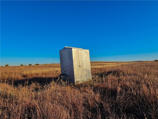 view of outdoor structure featuring a rural view