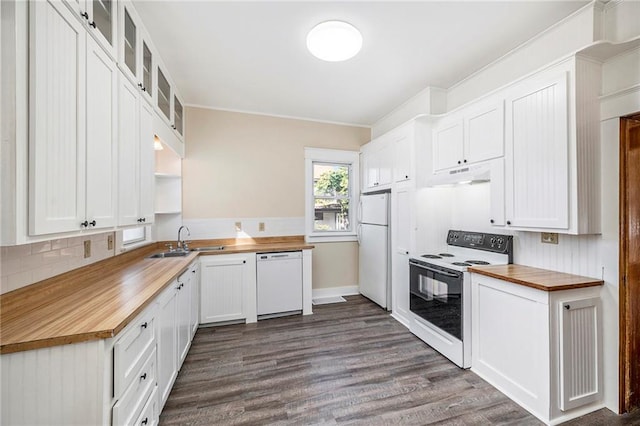 kitchen featuring white appliances, butcher block counters, sink, and white cabinets