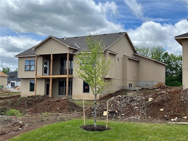 17013 Parkhill St, Overland Park, KS 66221 - back of house with a shingled roof and a balcony