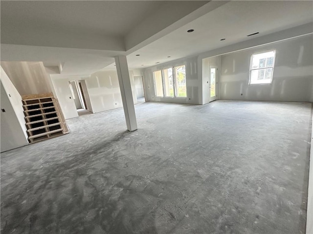 17013 Parkhill St, Overland Park, KS 66221 - unfurnished living room with unfinished concrete floors