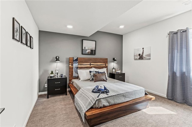 bedroom featuring light carpet, recessed lighting, and baseboards