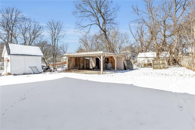 exterior space with a carport and an outdoor structure