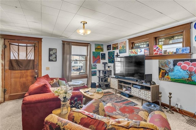 living area with baseboards and carpet flooring