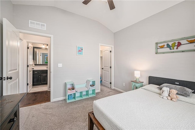 bedroom featuring light carpet, visible vents, baseboards, and vaulted ceiling