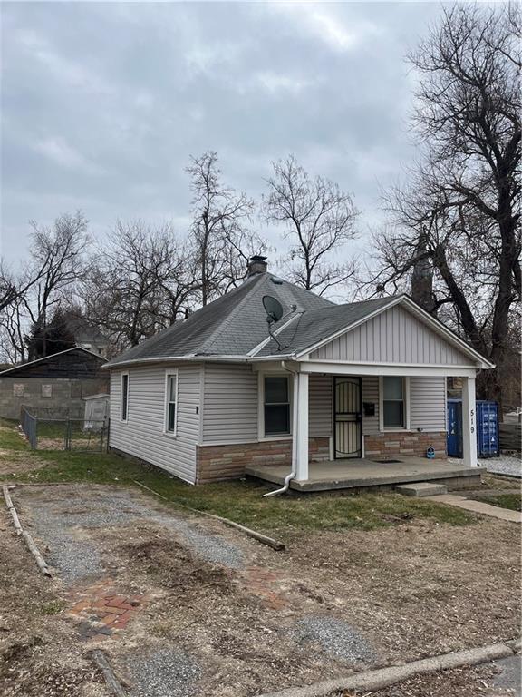 rear view of property with a porch