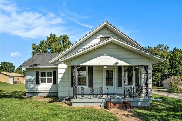 bungalow featuring a porch and a front yard