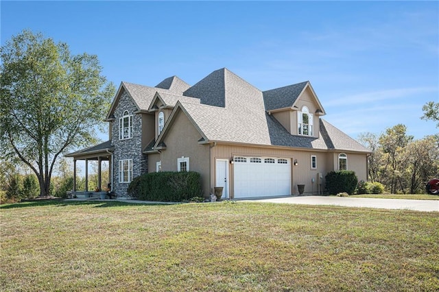 view of front property featuring a garage and a front lawn