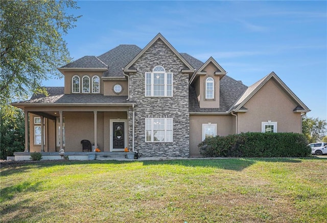 view of front of property with covered porch and a front lawn