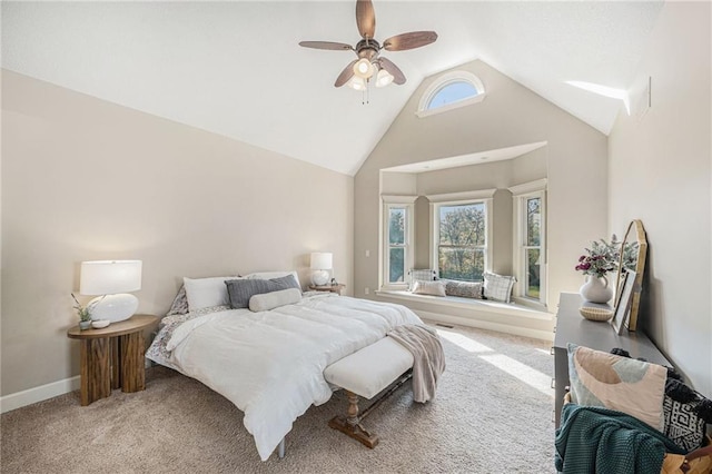 carpeted bedroom with ceiling fan, high vaulted ceiling, and multiple windows