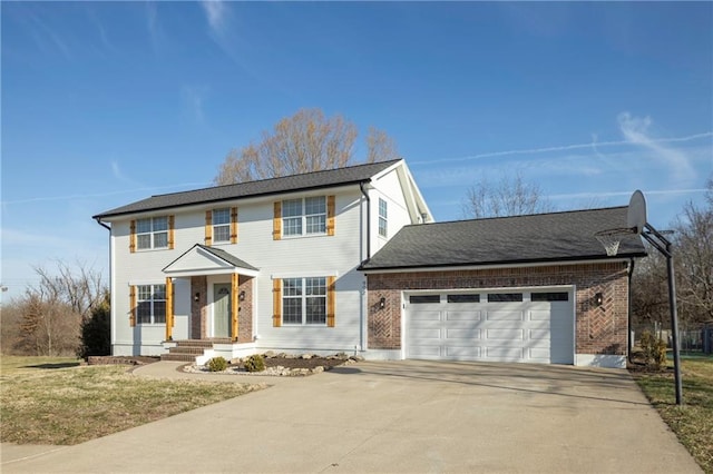 colonial inspired home with an attached garage and driveway