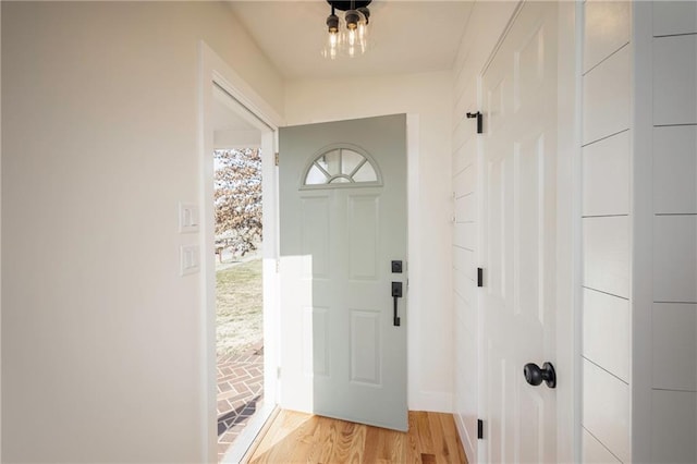 foyer entrance with light wood-style floors