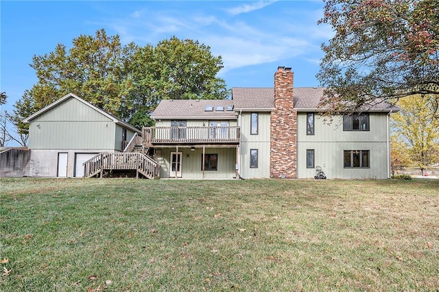 rear view of property with a lawn and a deck