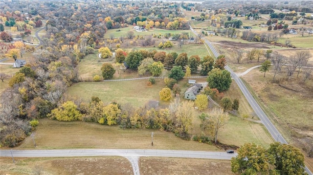 birds eye view of property featuring a rural view