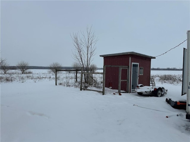 exterior space with an outdoor structure and a shed