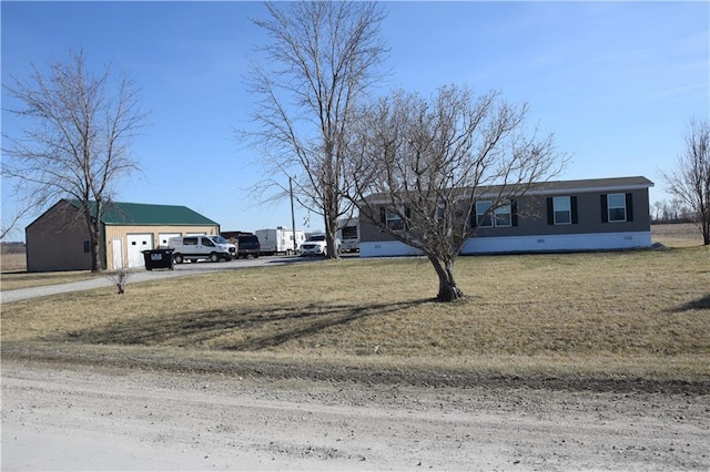 view of front of home with crawl space, driveway, a garage, and a front lawn