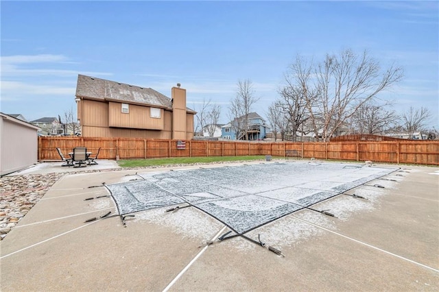 view of pool with a patio area and a fenced backyard