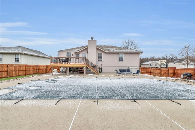 view of swimming pool with a patio area, a fenced backyard, stairway, and a wooden deck