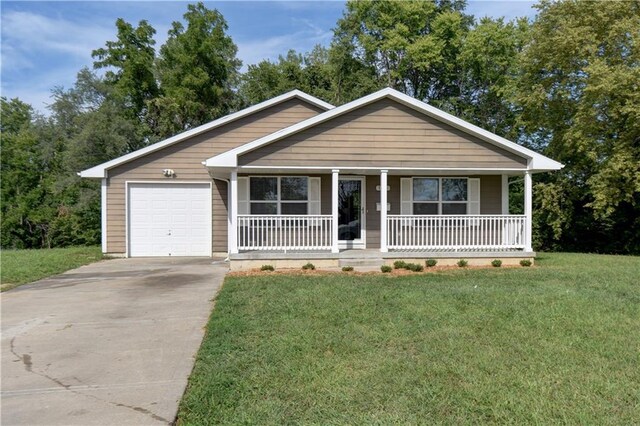 view of front of home with a porch, concrete driveway, an attached garage, and a front lawn