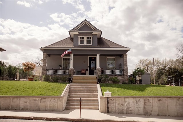 view of front of house featuring a front lawn and a porch