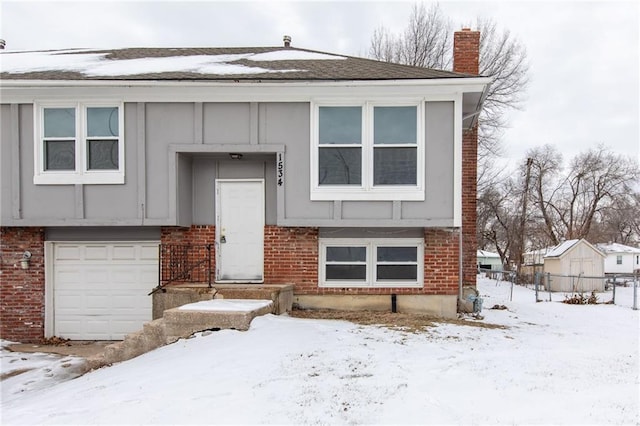 split foyer home featuring a garage