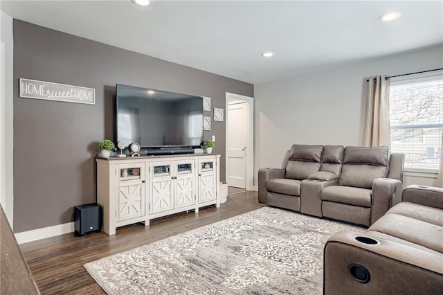 living room featuring dark wood-style floors, baseboards, and recessed lighting