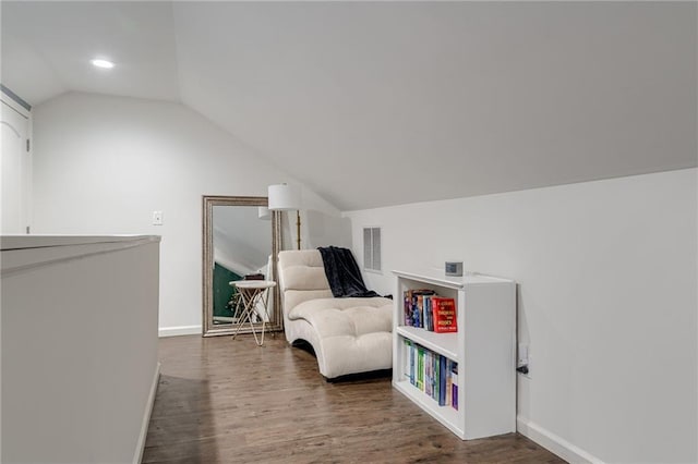 living area featuring lofted ceiling, recessed lighting, dark wood-type flooring, visible vents, and baseboards