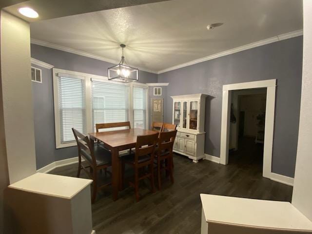 dining area with dark wood-type flooring and ornamental molding