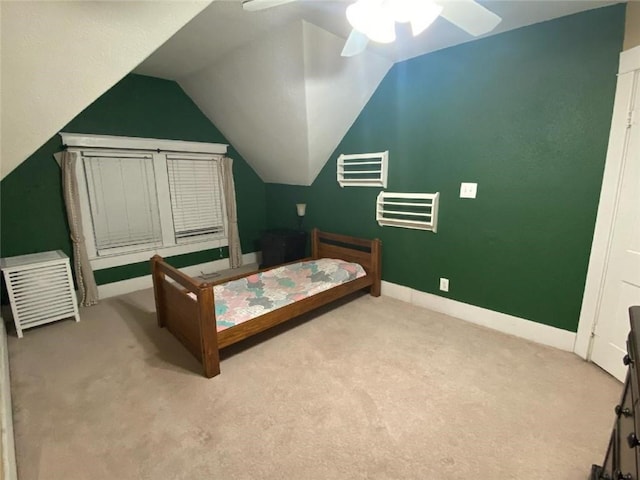 bedroom featuring lofted ceiling, light colored carpet, and ceiling fan