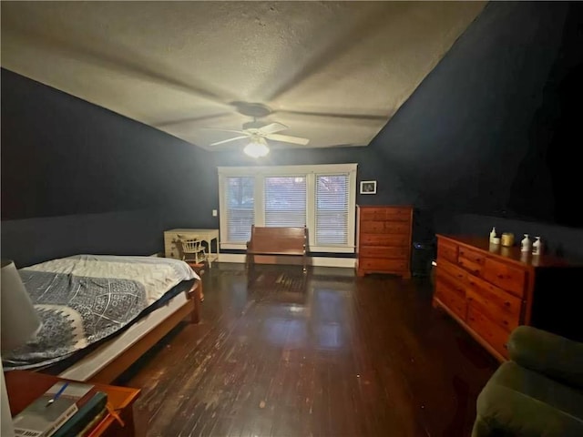 bedroom with ceiling fan, dark hardwood / wood-style flooring, and vaulted ceiling