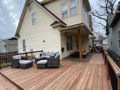 wooden terrace with outdoor lounge area