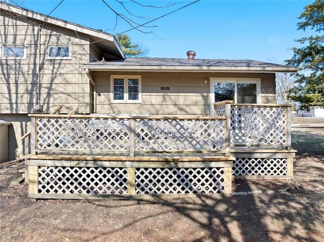 back of house featuring a wooden deck