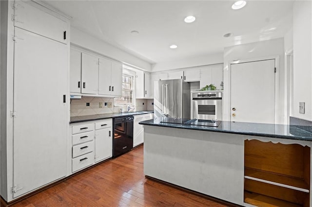 kitchen featuring recessed lighting, dark wood-style flooring, white cabinets, black appliances, and tasteful backsplash