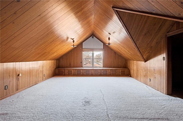 bonus room with wood ceiling, wood walls, carpet, and vaulted ceiling