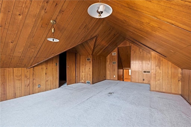 bonus room featuring carpet floors, lofted ceiling, wooden ceiling, and wooden walls