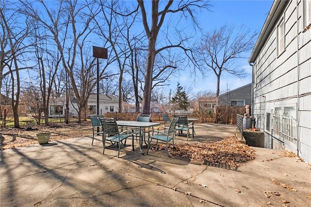 view of patio / terrace featuring outdoor dining space and fence