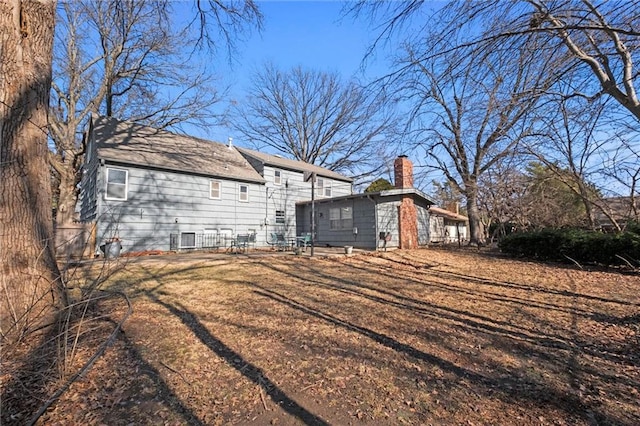 view of side of property with a chimney