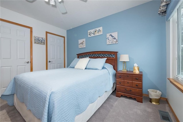 bedroom featuring ceiling fan and light colored carpet