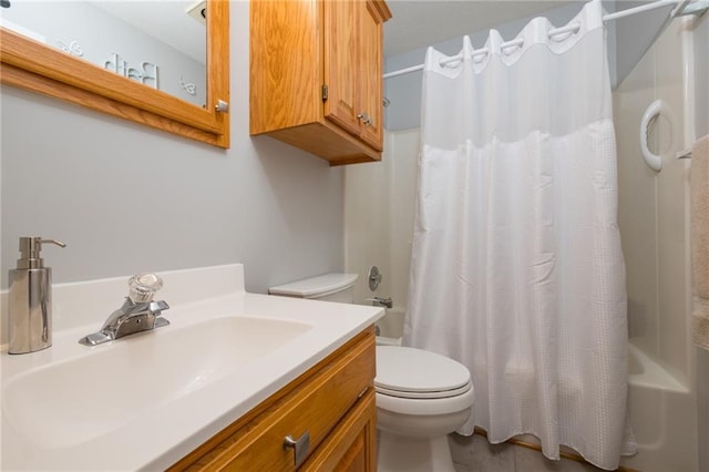 full bathroom featuring tile patterned floors, toilet, shower / bath combination with curtain, and vanity