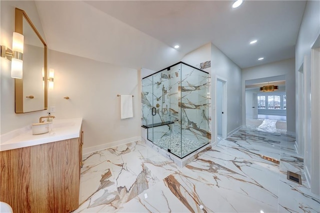 bathroom featuring marble finish floor, a marble finish shower, recessed lighting, vanity, and baseboards