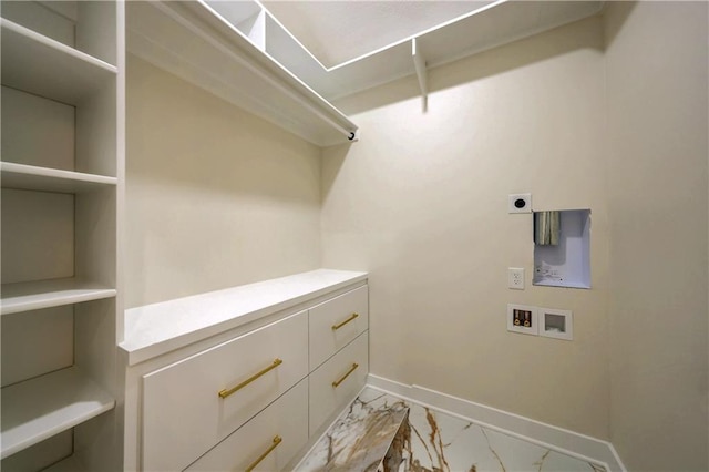 washroom with hookup for a washing machine, baseboards, marble finish floor, cabinet space, and electric dryer hookup