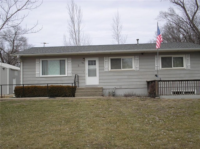 ranch-style home featuring a front yard