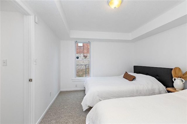 bedroom with baseboards and carpet flooring