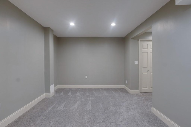 finished below grade area with recessed lighting, light colored carpet, and baseboards