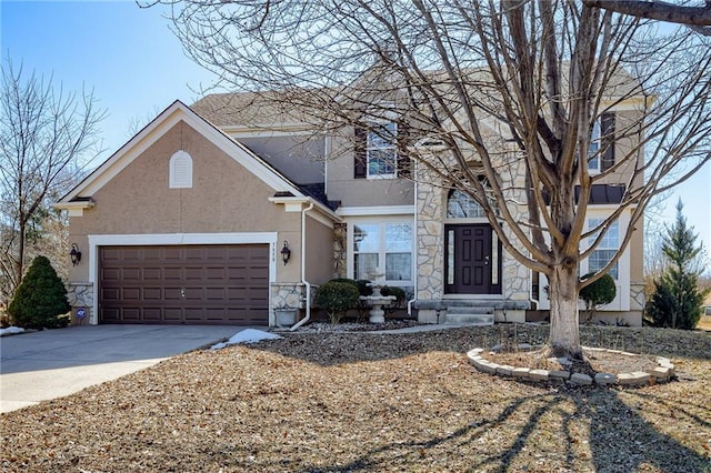 view of front of house with a garage, driveway, stone siding, and stucco siding