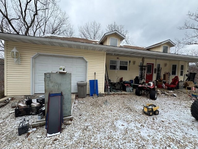 exterior space featuring a porch and a garage